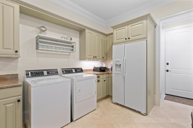 3002 Bay Villas Dr, Miramar Beach, FL 32550 - washroom with cabinet space, ornamental molding, independent washer and dryer, and light tile patterned flooring