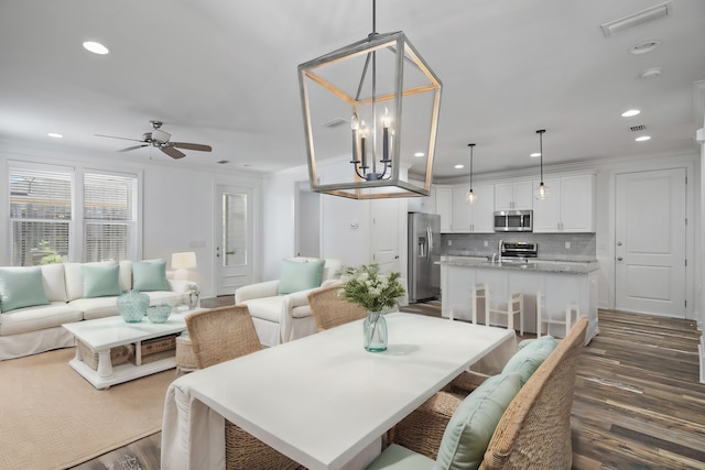 dining space featuring dark wood-type flooring, recessed lighting, ceiling fan, and visible vents