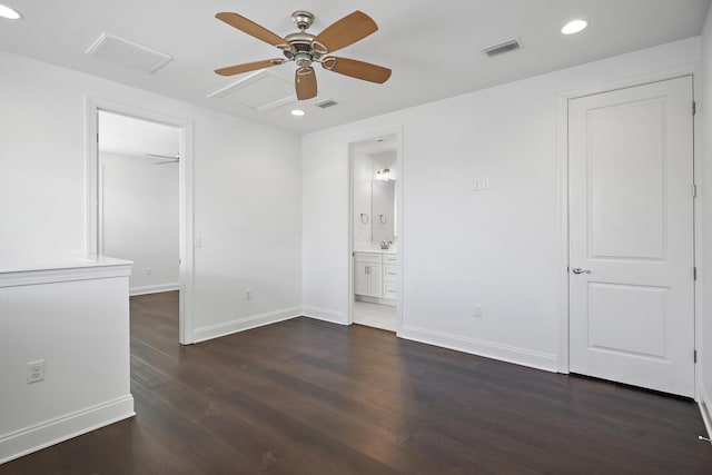 unfurnished bedroom with visible vents, recessed lighting, dark wood-style flooring, and a spacious closet