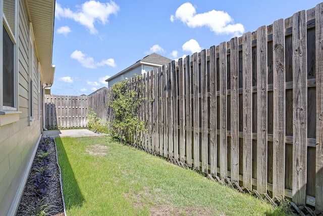 view of yard with a fenced backyard