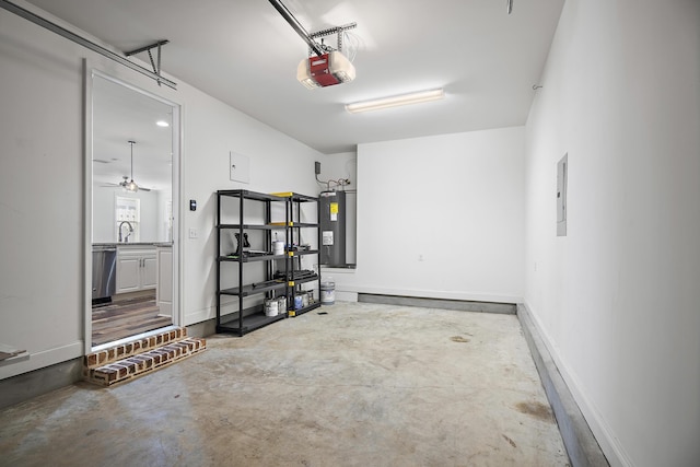 garage featuring water heater, a garage door opener, a sink, and electric panel