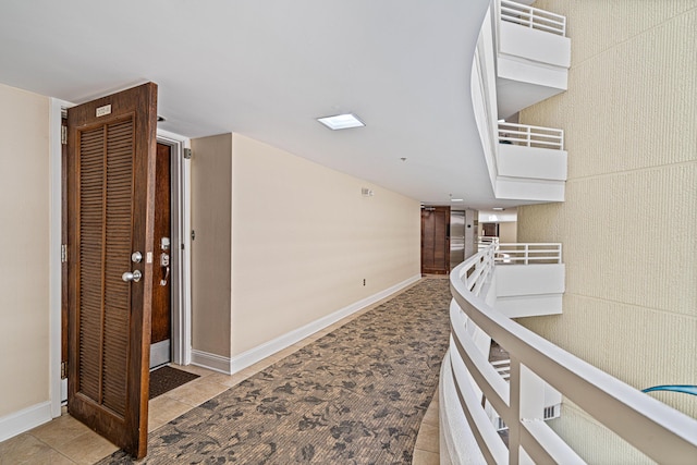 100 Gulf Shore Dr Unit 202, Destin, FL 32541 - hallway with baseboards and light tile patterned flooring