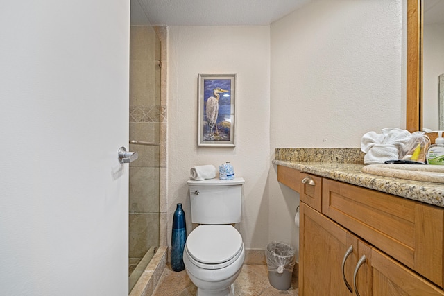 100 Gulf Shore Dr Unit 202, Destin, FL 32541 - bathroom featuring vanity, a tile shower, and toilet