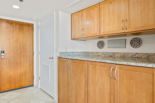 100 Gulf Shore Dr Unit 202, Destin, FL 32541 - interior space featuring visible vents, recessed lighting, baseboards, and light stone countertops