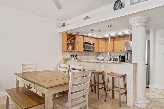 100 Gulf Shore Dr Unit 202, Destin, FL 32541 - dining room with crown molding, baseboards, decorative columns, and stone finish flooring