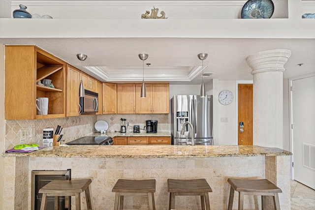 100 Gulf Shore Dr Unit 202, Destin, FL 32541 - kitchen featuring stainless steel appliances, open shelves, a sink, a peninsula, and a tray ceiling