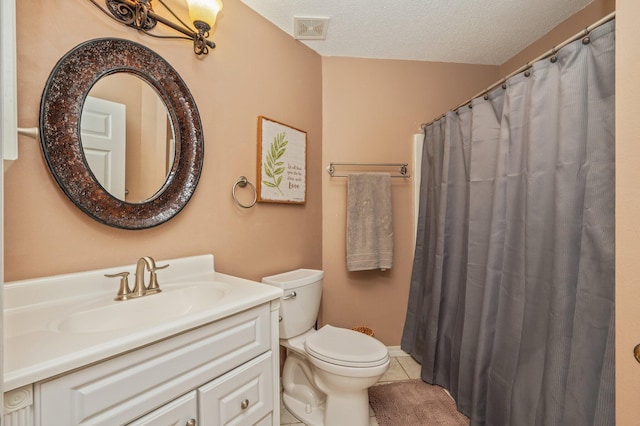 full bathroom with visible vents, vanity, toilet, a textured ceiling, and tile patterned floors