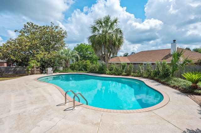 view of pool featuring a fenced in pool, a patio area, and fence