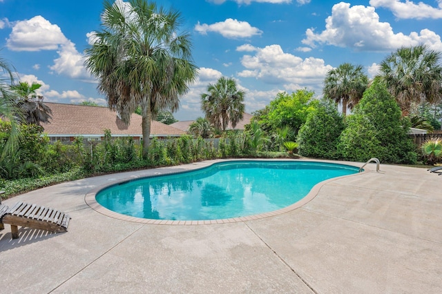 view of pool with fence, a fenced in pool, and a patio