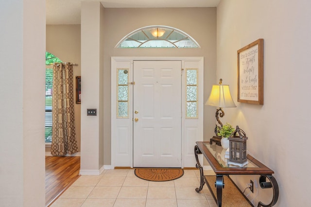 foyer featuring baseboards