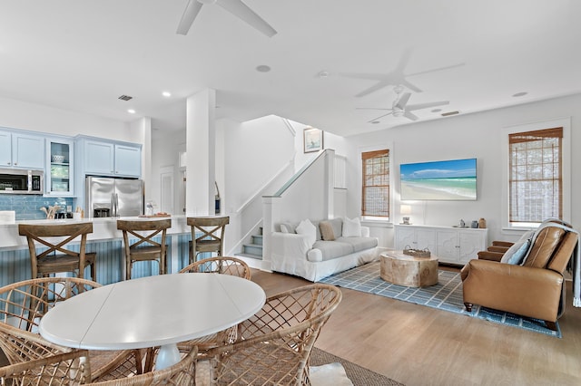 97 Sarasota St, Miramar Beach, FL 32550 - living room featuring ceiling fan, visible vents, wood finished floors, stairway, and recessed lighting