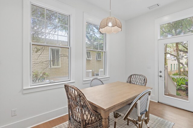 97 Sarasota St, Miramar Beach, FL 32550 - dining area featuring visible vents, wood finished floors, and a healthy amount of sunlight