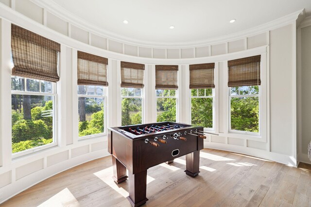 68 Creek Bridge Way, Watersound, FL 32461 - game room with plenty of natural light, ornamental molding, and light wood-type flooring