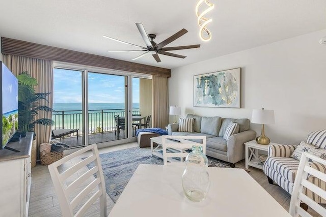 1751 Scenic Highway 98 Unit 906, Destin, FL 32541 - living room with a ceiling fan, a water view, and wood finished floors