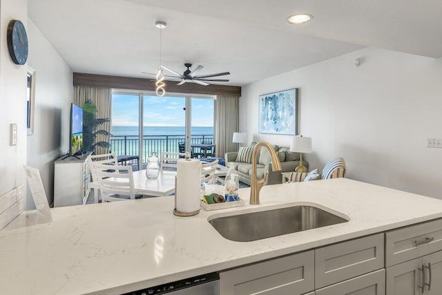 1751 Scenic Highway 98 Unit 906, Destin, FL 32541 - kitchen featuring a ceiling fan, recessed lighting, gray cabinets, light stone counters, and a sink