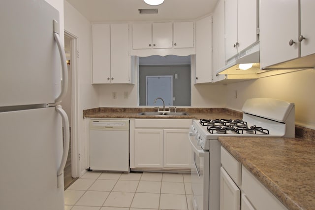 kitchen with under cabinet range hood, white cabinetry, a sink, and white appliances