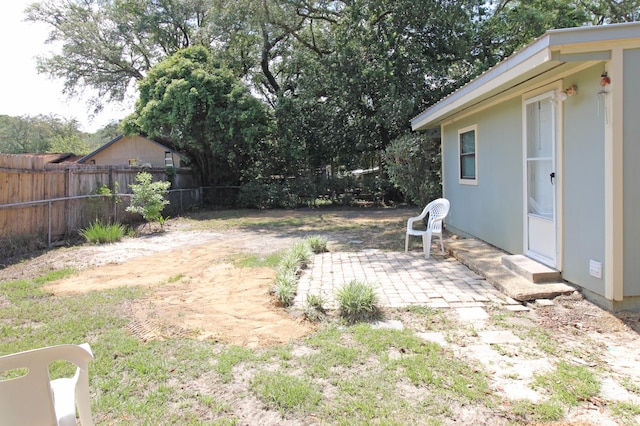 view of yard with a patio and fence