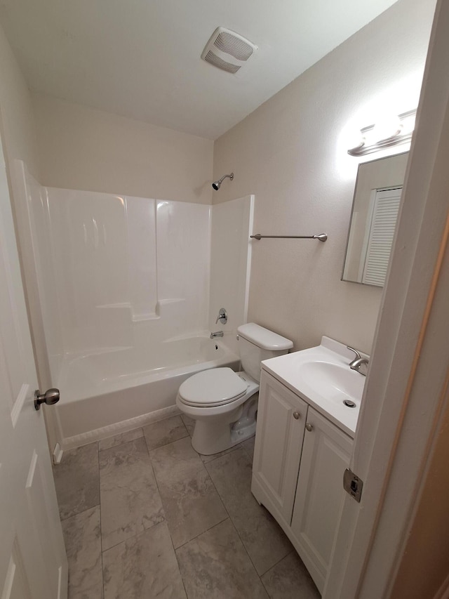 bathroom featuring vanity, toilet, marble finish floor, shower / bath combination, and visible vents