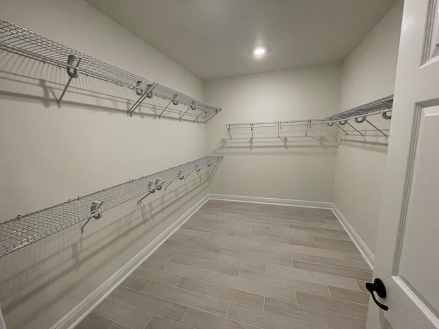 973 Coastal Breeze Dr, Freeport, FL 32439 - spacious closet featuring wood finished floors