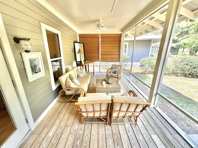 sunroom / solarium featuring ceiling fan