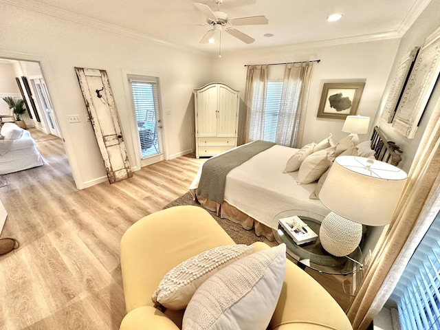 bedroom with multiple windows, crown molding, baseboards, light wood-style floors, and recessed lighting