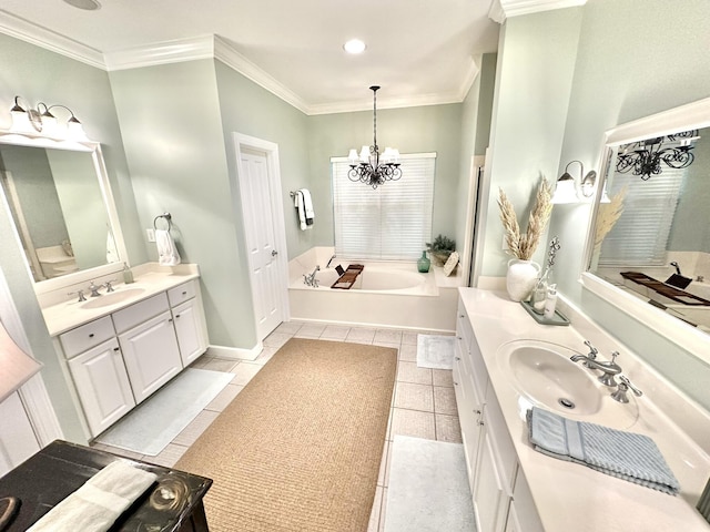 bathroom featuring two vanities, ornamental molding, a chandelier, tile patterned floors, and a garden tub