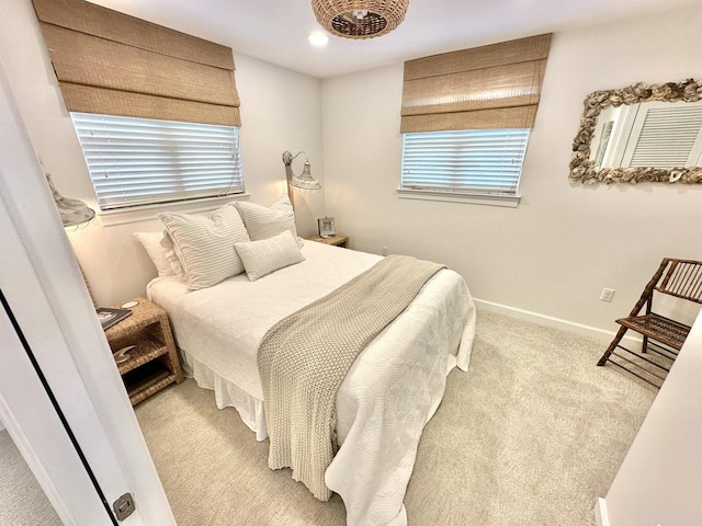 bedroom with light carpet, baseboards, and recessed lighting