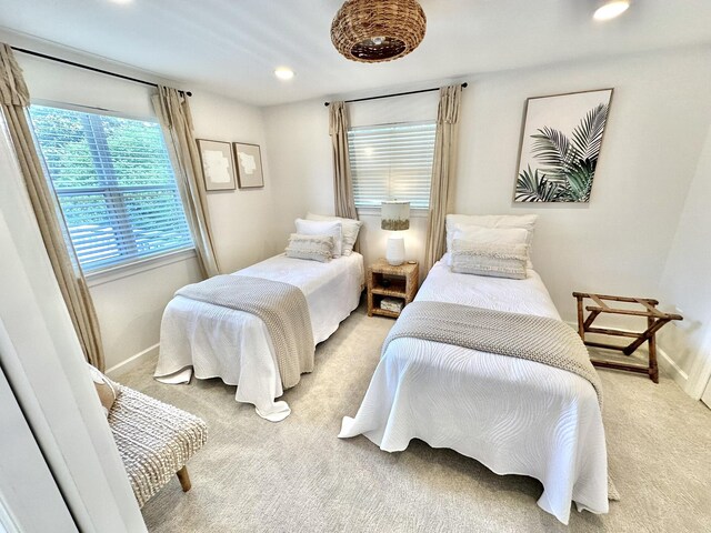 bedroom with light carpet, baseboards, and recessed lighting
