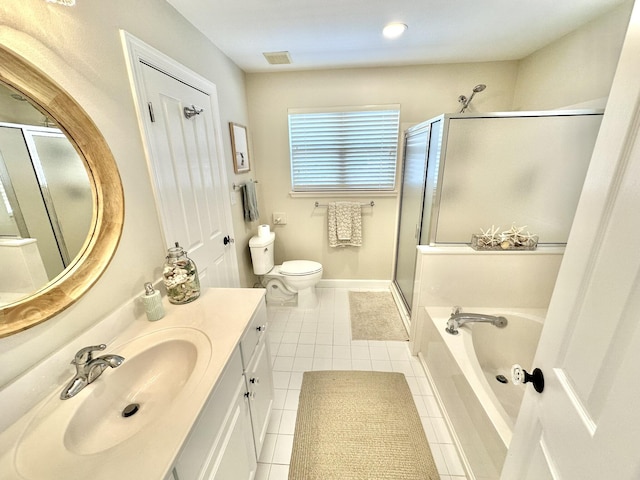 full bathroom featuring tile patterned flooring, a stall shower, vanity, a bath, and toilet
