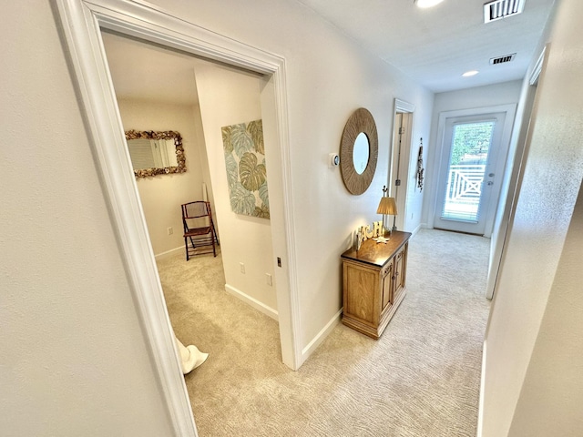 hall with light carpet and baseboards