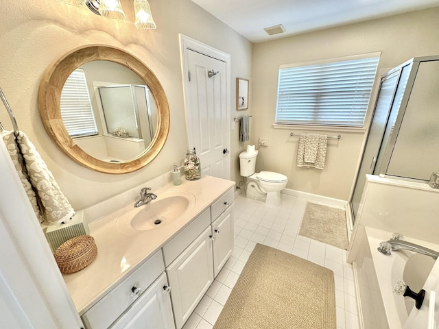 bathroom featuring a stall shower, vanity, toilet, tile patterned flooring, and a garden tub