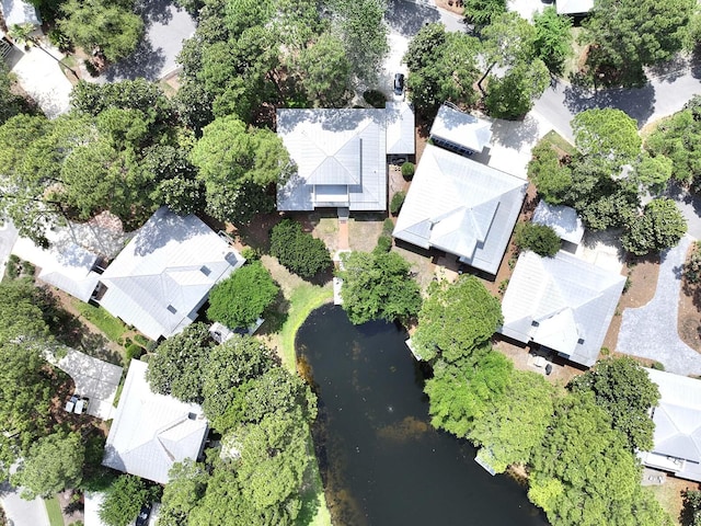 aerial overview of property's location with a large body of water and nearby suburban area