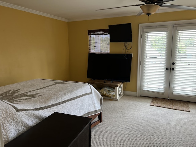 bedroom with crown molding, multiple windows, carpet flooring, and access to exterior