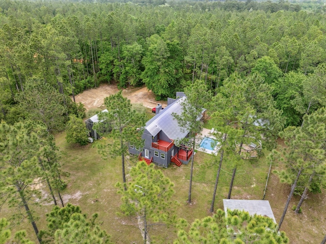 aerial view with a wooded view