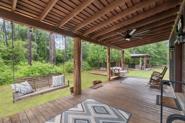 deck with a yard, a gazebo, and a ceiling fan