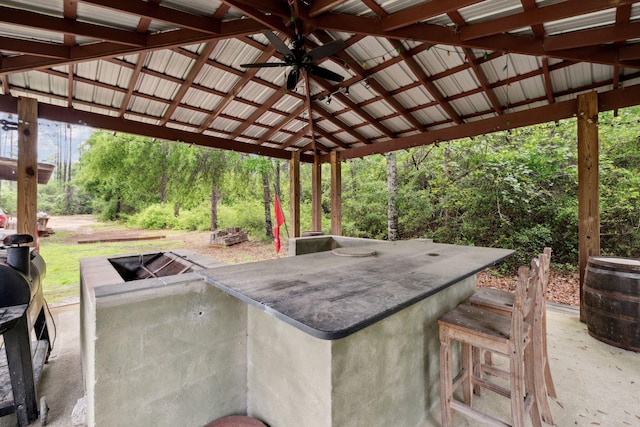 view of patio with outdoor dry bar, a gazebo, and ceiling fan