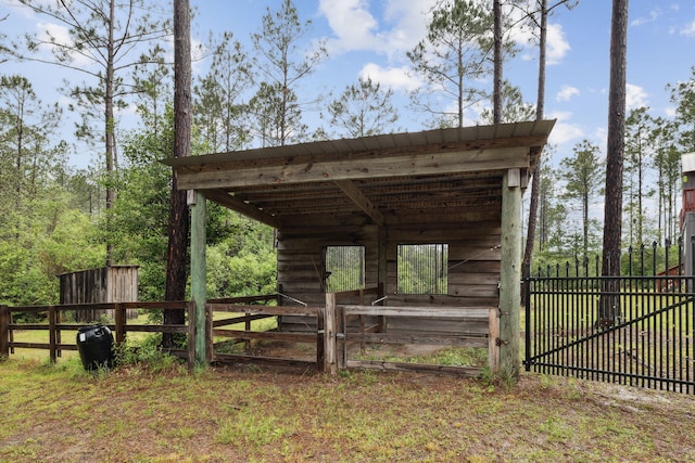 exterior space featuring fence and an outdoor structure