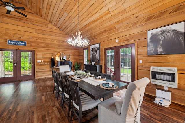dining area featuring wood walls, french doors, heating unit, wooden ceiling, and vaulted ceiling