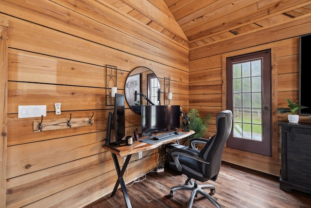 office with wooden walls, vaulted ceiling, and wood finished floors
