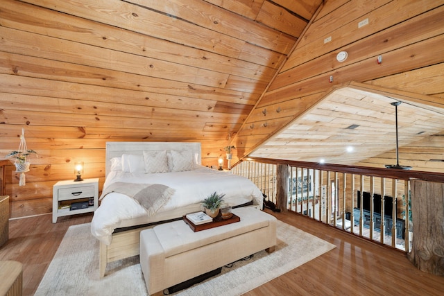bedroom featuring wood ceiling, wood walls, and wood finished floors