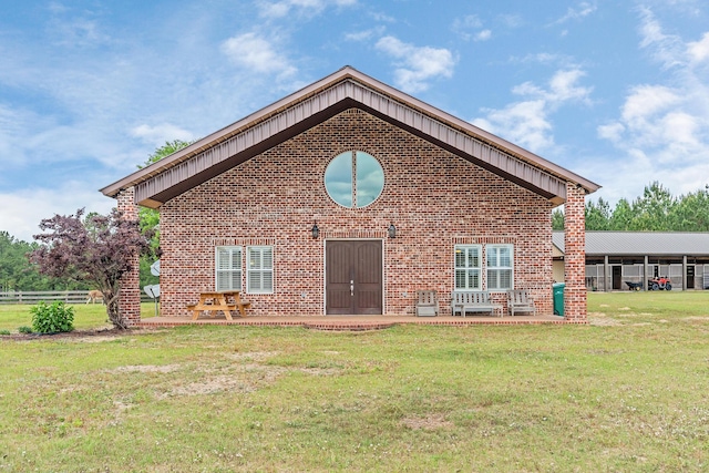 126 Tall Oaks Rd, Defuniak Springs, FL 32435 - rear view of house featuring fence, a yard, a patio area, and brick siding
