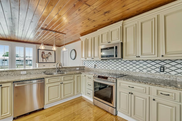 126 Tall Oaks Rd, Defuniak Springs, FL 32435 - kitchen featuring appliances with stainless steel finishes, cream cabinets, and wooden ceiling