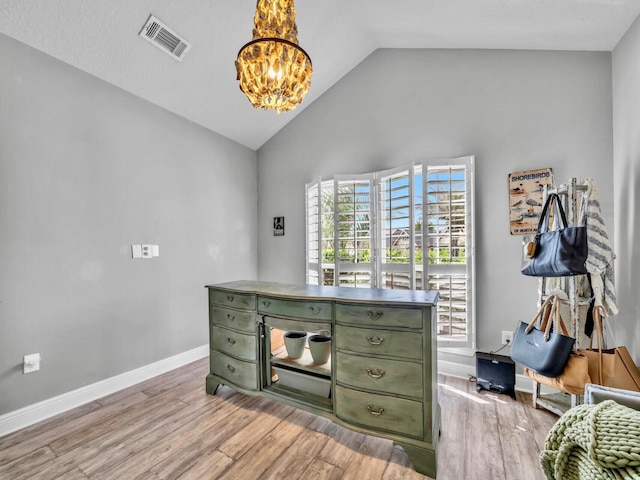 214 Whispering Lake Dr, Santa Rosa Beach, FL 32459 - office area with a chandelier, lofted ceiling, visible vents, and light wood-style floors