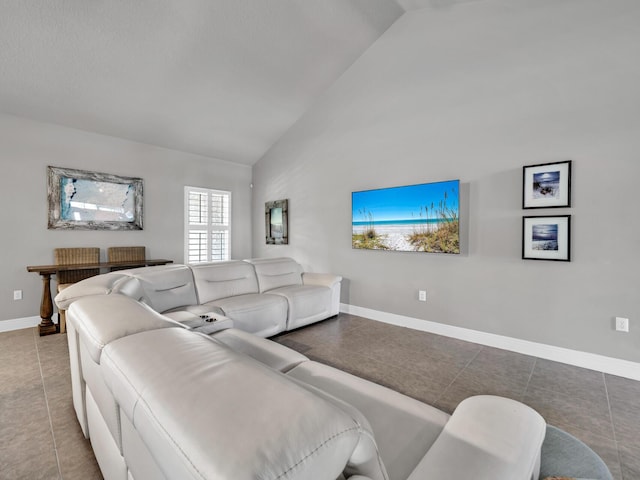 214 Whispering Lake Dr, Santa Rosa Beach, FL 32459 - living area with tile patterned flooring, baseboards, and high vaulted ceiling