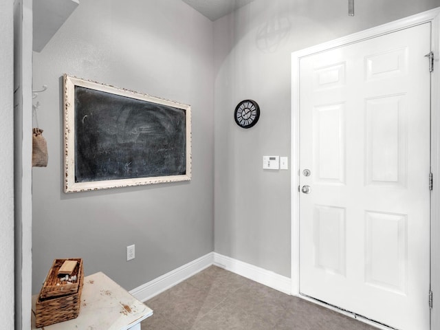 214 Whispering Lake Dr, Santa Rosa Beach, FL 32459 - tiled entryway featuring baseboards