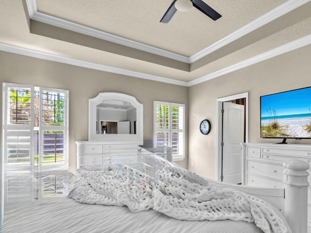 214 Whispering Lake Dr, Santa Rosa Beach, FL 32459 - bedroom featuring crown molding, a textured ceiling, a raised ceiling, and ceiling fan