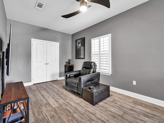 214 Whispering Lake Dr, Santa Rosa Beach, FL 32459 - living area featuring ceiling fan, wood finished floors, and baseboards