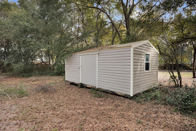view of shed with fence