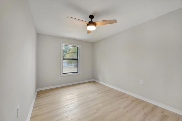 unfurnished room with light wood-style floors, baseboards, and ceiling fan