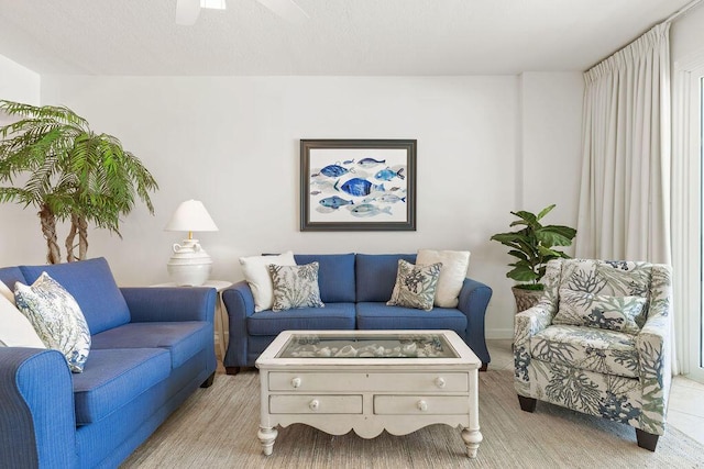 living area featuring ceiling fan